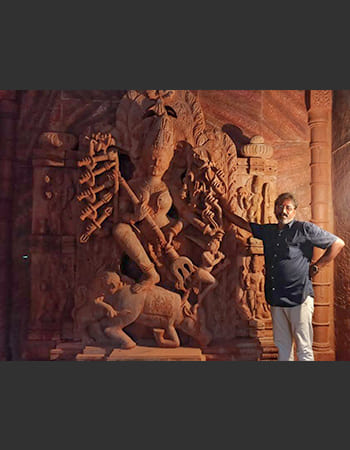 Corporate lobby stone carving featuring intricate architectural details and cultural motifs