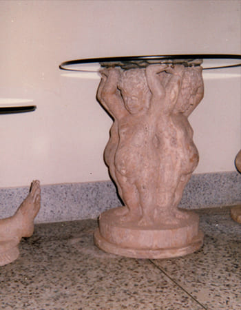 Powerful pink marble Durga sculpture with multiple arms and detailed weapon carvings in traditional Odia style