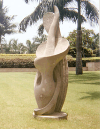 Powerful pink marble Durga sculpture with multiple arms and detailed weapon carvings in traditional Odia style