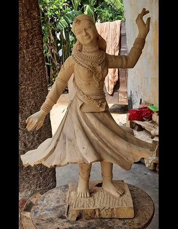 Wooden wall panel with elaborate carvings depicting nature scenes and traditional patterns